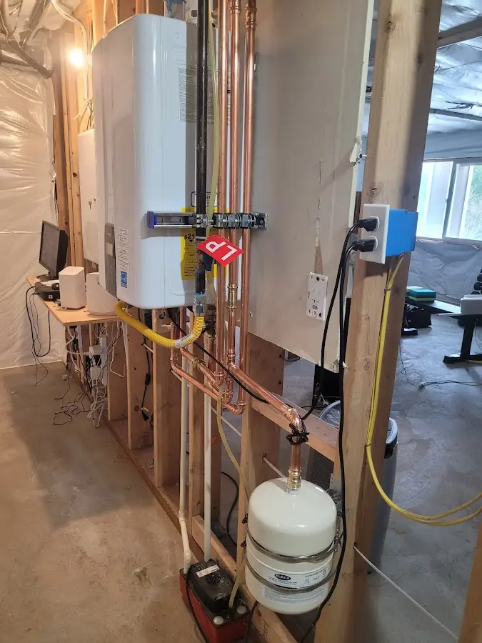 Licensed plumber repairing a kitchen sink in Stow